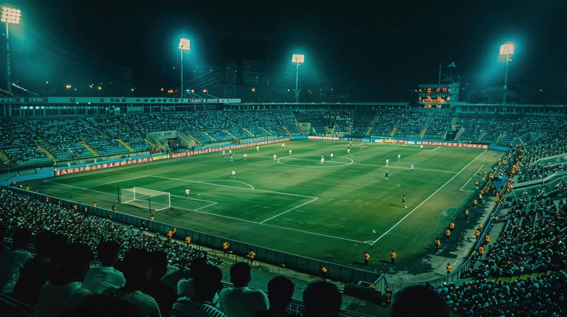Estadio de futbol home_presente a través de la pantalla